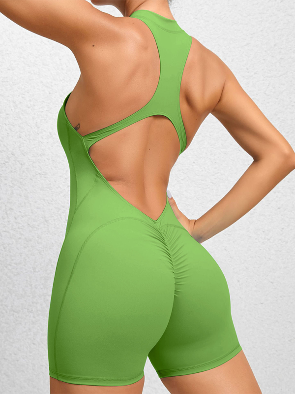 Einteiliger Fitness-Overall mit plissierten Details und pfirsichfarbenen Akzenten