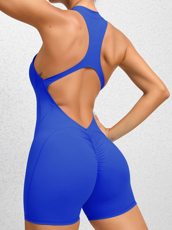 Einteiliger Fitness-Overall mit plissierten Details und pfirsichfarbenen Akzenten